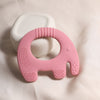 Anneau de dentition éléphant rose en silicone avec textures apaisantes sur tissu beige - Bébé Lova
