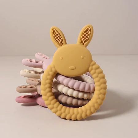 Anneaux de dentition lapin en silicone empilés avec textures sensorielles pastel pour bébé - Bébé Lova