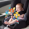 Bébé souriant dans son siège auto avec arche musicale interactive et hochets suspendus - Bébé Lova