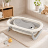 Baignoire bébé pliable avec coussin ergonomique dans une salle de bain bébé moderne - Bébé Lova