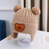 Bonnet hiver bébé beige caramel avec pompons et visage ourson brodé - Bébé Lova