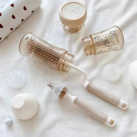 Brosse pour biberon insérée dans un biberon avec brosse pour tétine et accessoires de nettoyage - Bébé Lova