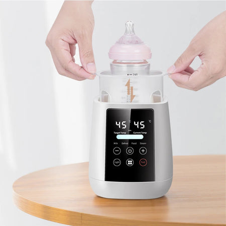 Chauffe-biberon intelligent avec biberon en cours de chauffage et affichage digital 45°C - Bébé Lova