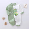 Combinaison bébé en coton vert et blanc à motif dinosaure couronné, manches longues et fermeture pression - Bébé Lova