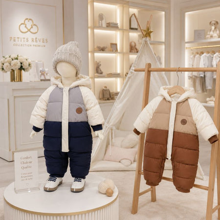 Combinaisons bébé d'hiver présentées en boutique sur mannequin et cintre dans une ambiance premium - Bébé Lova