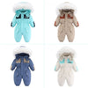 Combinaison de ski bébé à capuche fourrée, présentée en quatre coloris bicolores - Bébé Lova