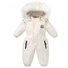 Combinaison de ski bébé écrue à capuche bordée de fourrure, présentée de face - Bébé Lova