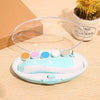 Version verte du coupe-ongles électrique bébé avec coffret transparent et embouts colorés - Bébé Lova