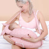 Maman allaitant bébé sur le coussin d'allaitement ergonomique NurseWrap rose avec sangle tour de cou - Bébé Lova