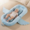 Coussin anti-reflux bébé déployé avec ailes latérales ouvertes pour un maintien ajustable - Bébé Lova
