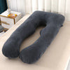 Coussin de grossesse noir charbon corps entier installé sur un lit beige - Bébé Lova
