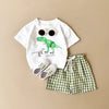 Ensemble bébé dinosaure avec short vert à carreaux et lunettes de soleil - Bébé Lova