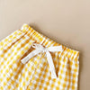 Détail du short bébé jaune à carreaux avec cordon blanc - Bébé Lova