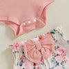 Détail des pressions du body et du nœud du bloomer rose fleuri - Bébé Lova