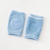 Paire de genouillères bébé bleu clair avec protection antidérapante sourire - Bébé Lova