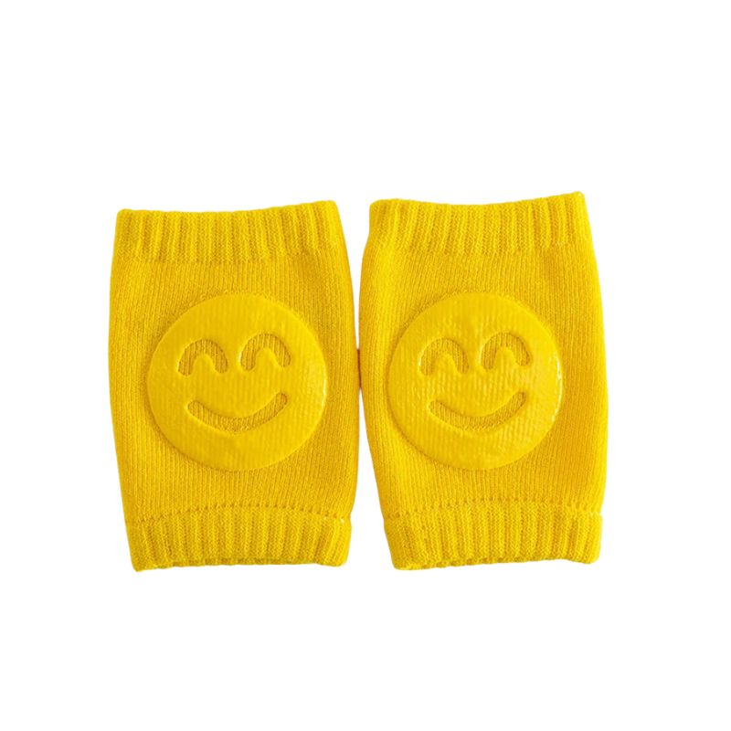 Paire de genouillères bébé jaunes avec motif sourire antiglisse - Bébé Lova