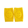 Paire de genouillères bébé jaunes avec motif sourire antiglisse - Bébé Lova