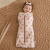 Bébé fille souriante gigoteuse ZipSack motif feuilles orange tapis tricoté - Bébé Lova