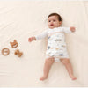 Bébé gigoteuse SnugWrap motif fleurs lifestyle jouets bois apaisé - Bébé Lova