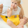 Harnais de sécurité pour chaise bébé jaune maintenant bébé pendant le repas à la cuillère - Bébé Lova