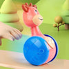 Jouet culbuteur bébé sur roulettes poussé par un enfant pour encourager le mouvement et la motricité - Bébé Lova