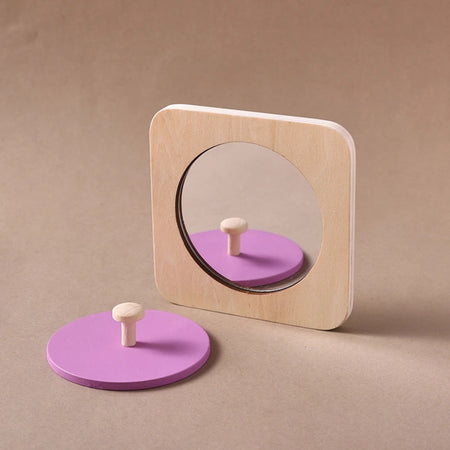 Puzzle miroir Montessori ouvert avec miroir visible et disque rose détachable - Bébé Lova