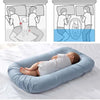 Bébé dormant dans un nid bébé ergonomique offrant une protection confortable pendant le sommeil - Bébé Lova