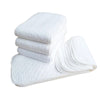 Vue produit du lot de 10 couches lavables pliables en coton blanc absorbant - Bébé Lova