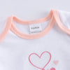 Détail du col extensible et finition douce d'un body bébé en coton premium - Bébé Lova