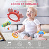 Bébé souriant jouant avec les hochets du mobile musical multifonction - Bébé Lova
