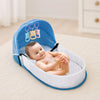Berceau de voyage bébé pliable avec moustiquaire intégrée et bébé allongé confortablement dans un cocon de sommeil nomade - Bébé Lova