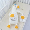 Peluche tapotante oie blanche avec paumes réconfortantes pour bébé - Bébé Lova
