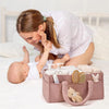 Organiseur de couches en peluche utilisé lors d’un moment complice entre maman et bébé - Bébé Lova