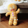Grande peluche pain d’épices souriante posée au sol dans une chambre enfant - Bébé Lova