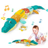 Peluche musicale hochet bébé crocodile MusicGator avec notes de musique colorées autour du jouet sensoriel - Bébé Lova