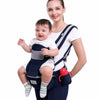 Porte-bébé ergonomique hipseat porté par une maman avec bébé assis face à elle - Bébé Lova