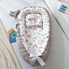 Nid cododo bébé portable avec imprimé arc-en-ciel et contour gris - Bébé Lova