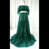Robe maternité verte en mousseline avec épaules dénudées présentée sur mannequin - Bébé Lova