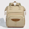 Sac à dos à langer coloris beige multifonction avec grande poche avant zippée et poignées renforcées - Bébé Lova
