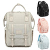 Sac à langer beige présenté avec ses coloris noir, rose et bleu - Bébé Lova