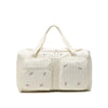 Vue de face du sac à langer EmbroidyMom avec motifs fleurs brodées - Bébé Lova
