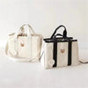 Sac à langer compact NappyPack disponible en deux coloris avec motifs ourson - Bébé Lova