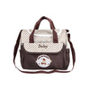 Sac à langer BearBag marron vue de face avec compartiments pratiques - Bébé Lova