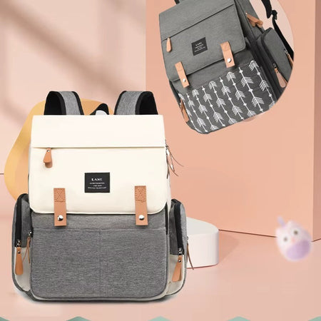 Sac à langer crème et gris présenté avec aperçu de sa doublure intérieure à motif flèches - Bébé Lova