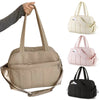 Sac à langer sport porté par les poignées, présenté dans ses différents coloris - Bébé Lova
