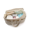 Intérieur du sac à langer rempli de couches, accessoires et essentiels pour bébé - Bébé Lova