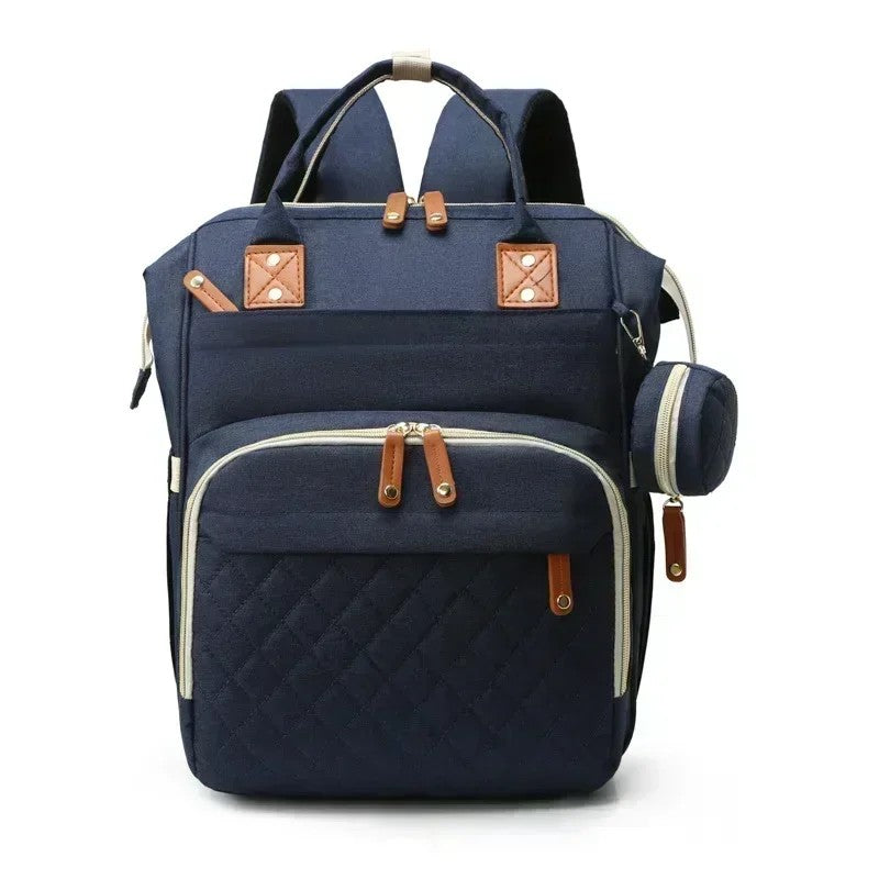 Sac à langer à dos coloris bleu marine présenté de face avec mini-pochette - Bébé Lova