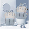 Sac à langer à dos coloris bleu et crème présenté sous deux angles - Bébé Lova