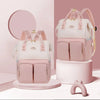 Sac à langer à dos coloris rose et blanc présenté sous deux angles - Bébé Lova