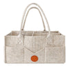 Sac de rangement à couches en feutre beige avec anses et compartiments, vue de face - Bébé Lova